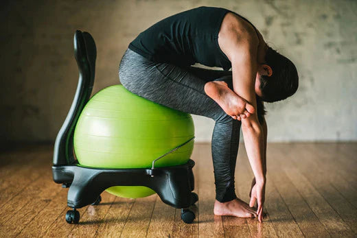 3 Stretches for Lower Back Pain without Getting Up from Your Chair – GetACTV