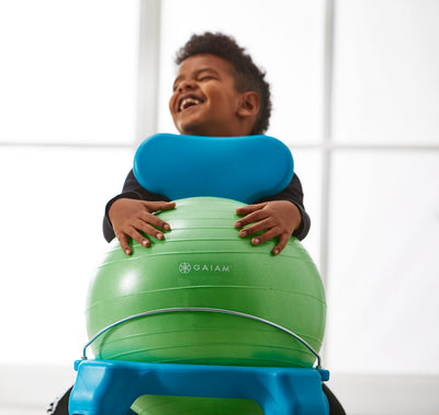 Smiling child with green & blue Kids Classic Balance Ball Chair