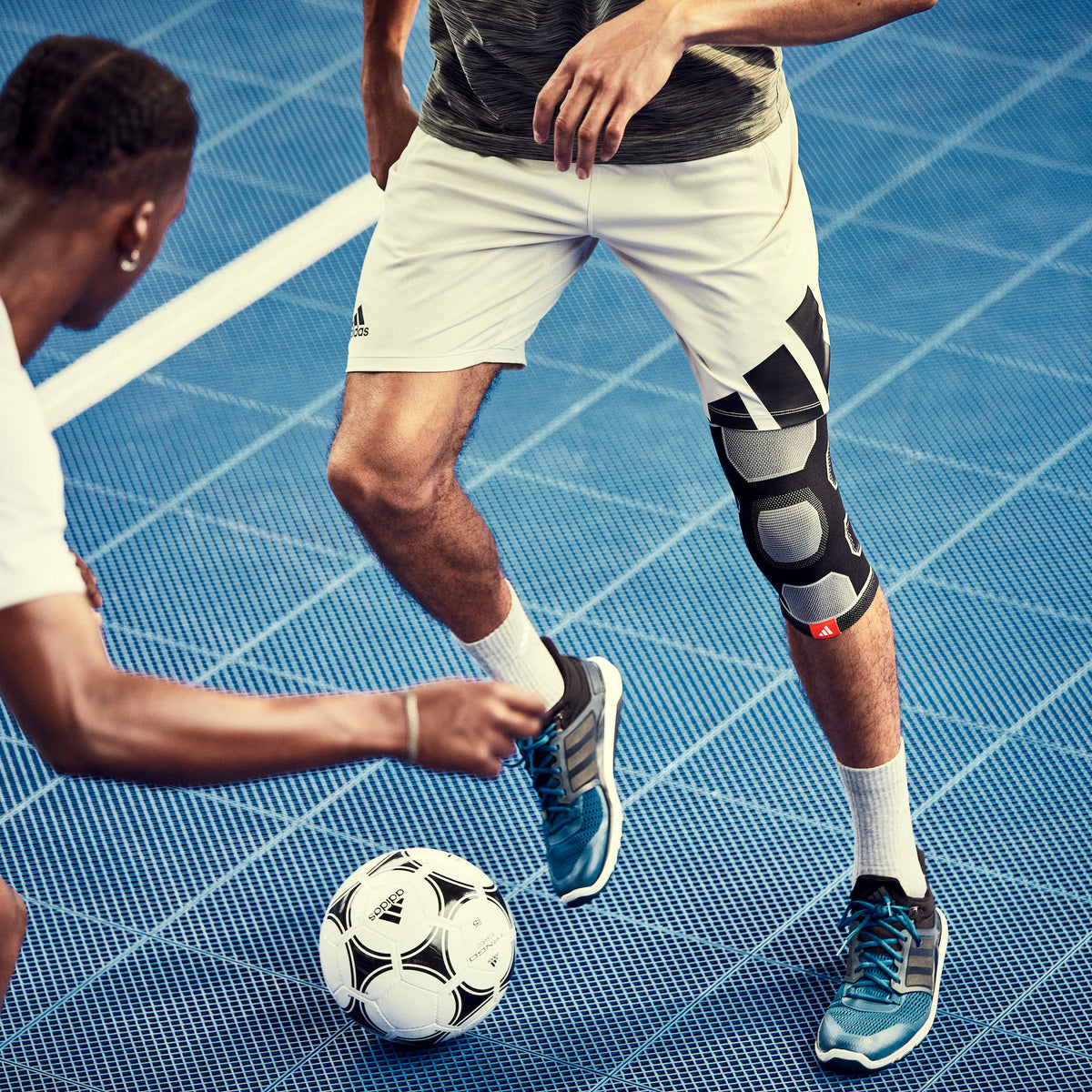 adias Premium Knee Support on man playing soccer