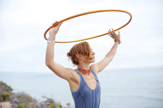 Woman holding a hula hoop for weight loss