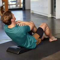 Person using the Ab Mat for sit ups 