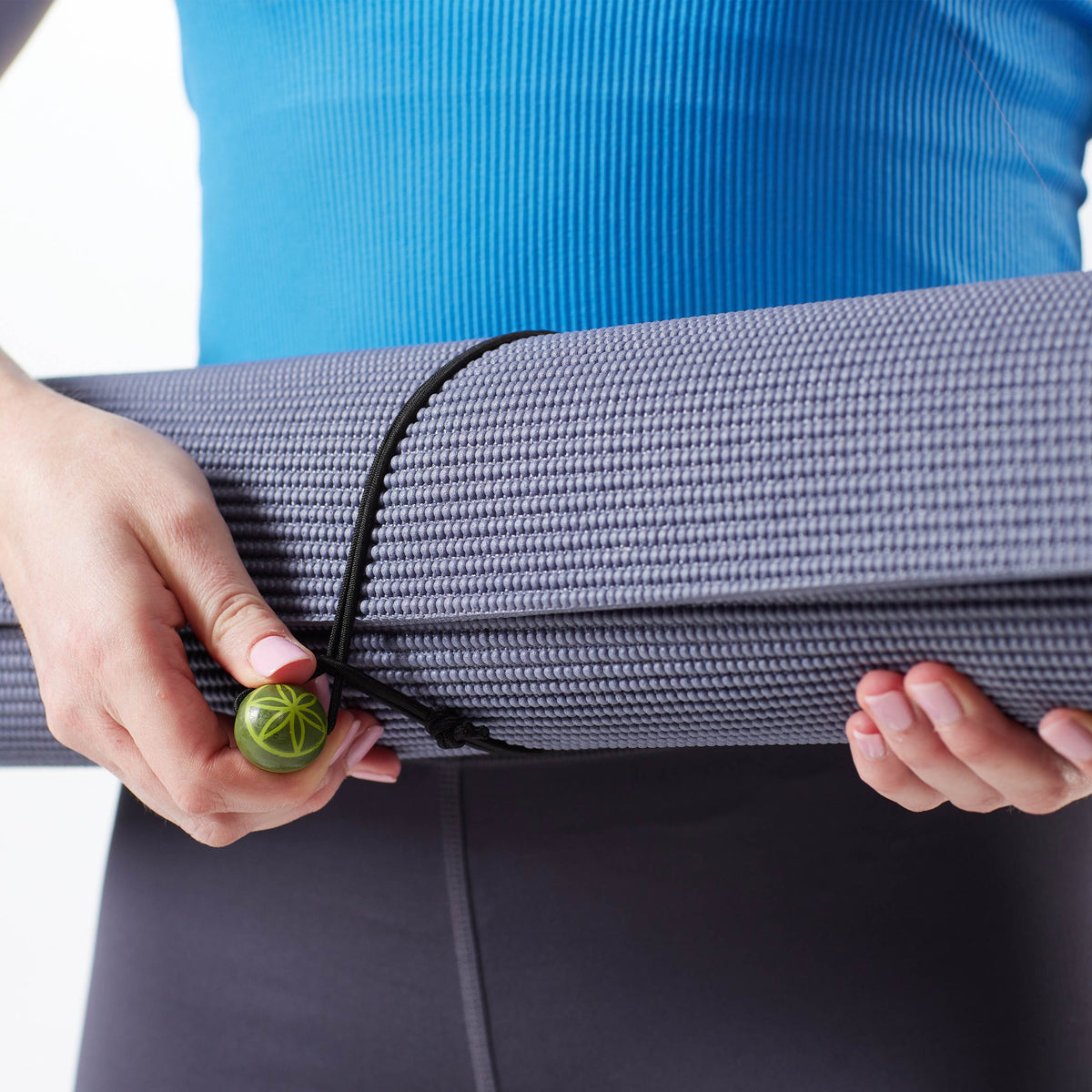 Up close image of Yoga Mat with the Yoga Mat Band wrapped around it.