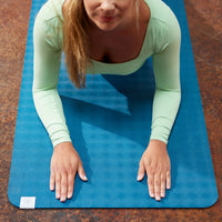 Up close of person in Cobra Pose on the Performance Ultra-Sticky Yoga Mat
