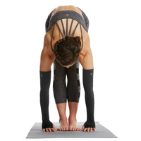 Person in forward front bend wearing Yoga Compression Arm Sleeves