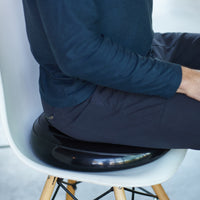 Image of person sitting on Balance Disc up close