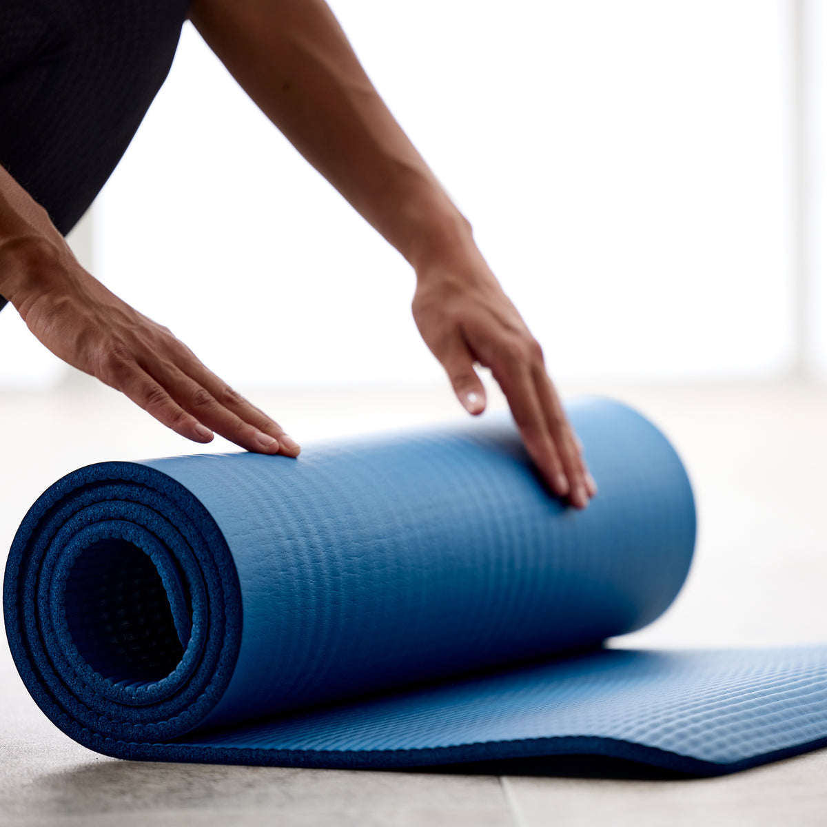 Up close rolling of the Gaiam Essentials Fitness Mat & Sling