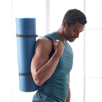 Person carrying the Gaiam Essentials Fitness Mat & Sling on shoulder