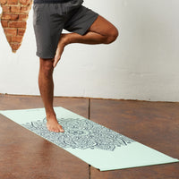 Up close of legs while in Tree Pose on the Mandala Sundial Yoga Mat