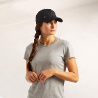 Person wearing the Classic Solara UV Protection Fitness Hat in black