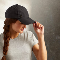 Up-close of person wearing the Classic Solara UV Protection Fitness Hat in black 