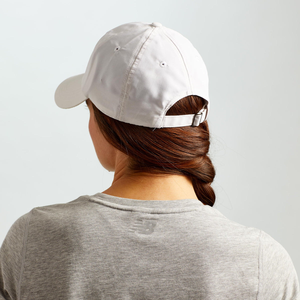 Behind view of the Classic Solara UV Protection Fitness Hat in white - shows the adjustable buckle