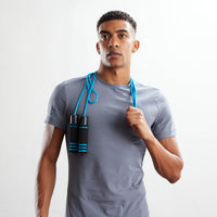 Image of person with the Weighted Jump Rope around shoulder showing off the rope