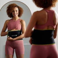 Person putting on the Slimmer Belt while looking in a mirror