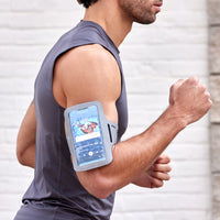 Up close of person running with the Running Arm Band on arm