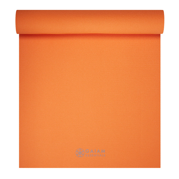 Gaiam Essentials Yoga Mat (6mm) Orange top rolled