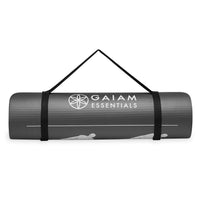 Gaiam Restore Essentials Self-Guided Fitness Mat (10mm) rolled up with sling