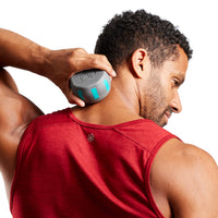 Person using the  Sure Grip Massage Roller on the back of the neck