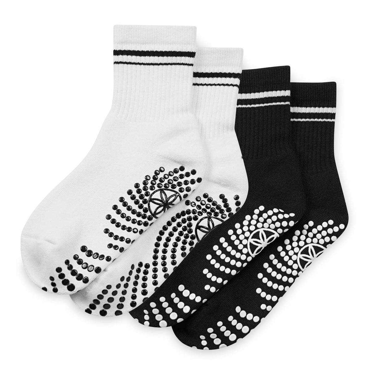 Pair of black and white socks with textured sole on a white background