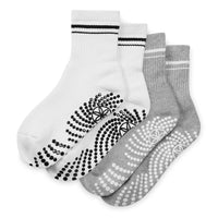 Two pairs of socks with non-slip patterns on a white background