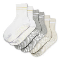 Set of five pairs of socks in white, gray, and beige on a white background