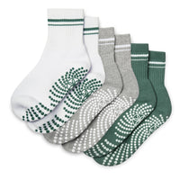 Set of five pairs of socks with unique patterns on a white background