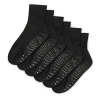 Set of black socks with textured sole on a white background