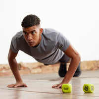 Person doing push up with Exercise Dice shown off to the side