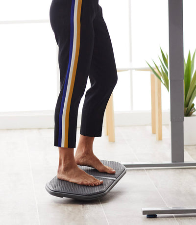 Person standing on Evolve Balance Board