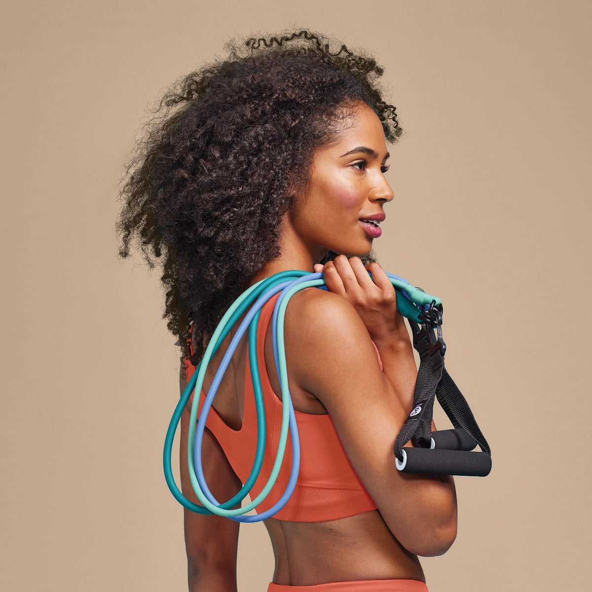 woman with POPSUGAR 3-In-1 Resistance Cord over shoulder