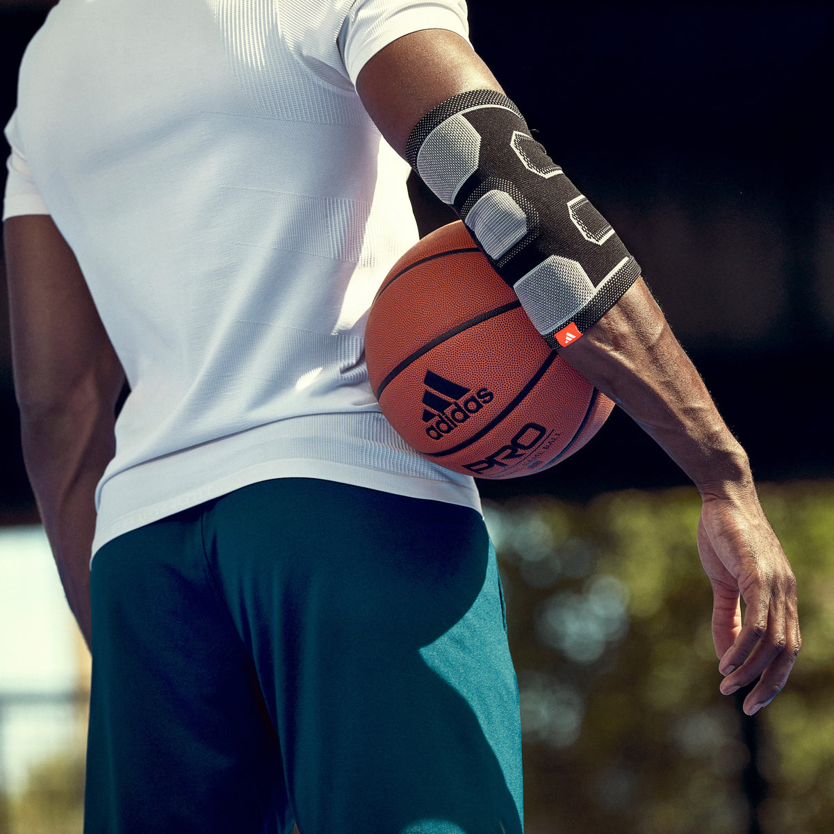 adidas Premium Elbow Support on man playing basketball