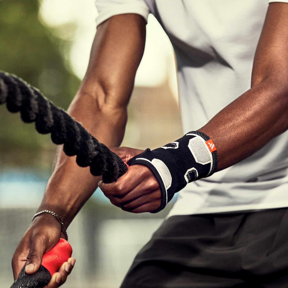 adidas Premium Wrist Support on man with training ropes