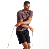 Person using the New Balance Classic Speed Rope in cross over jump