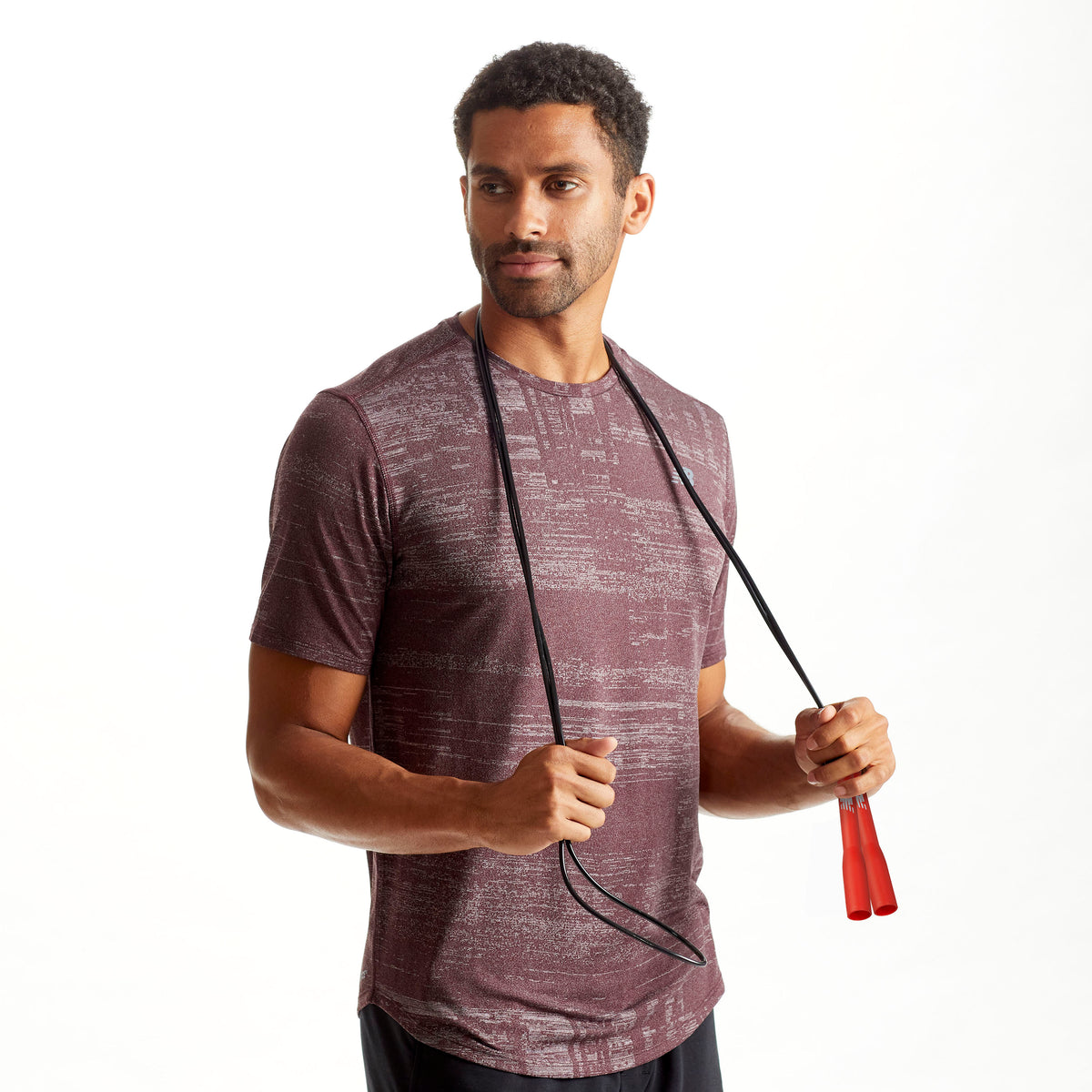 Person with the New Balance Classic Speed Rope draped around the shoulders  