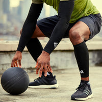 adidas Compression Calf Sleeves - Black on man working out