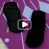 Video of woman showing Grippy Fit Socks on yoga mat