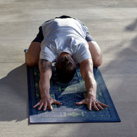Person in child's pose on Boho Fold Yoga Mat