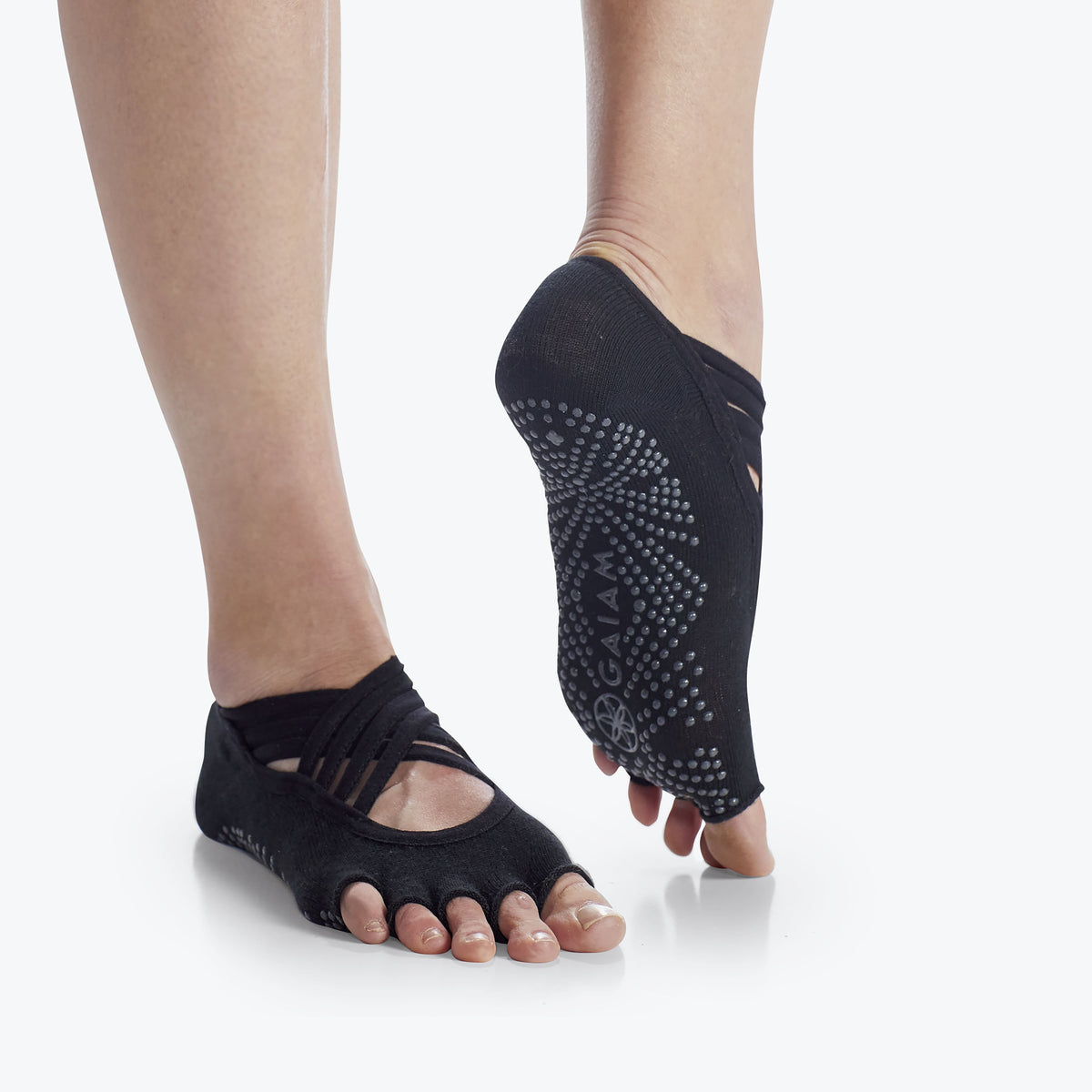 Grippy yoga socks on woman's feet.