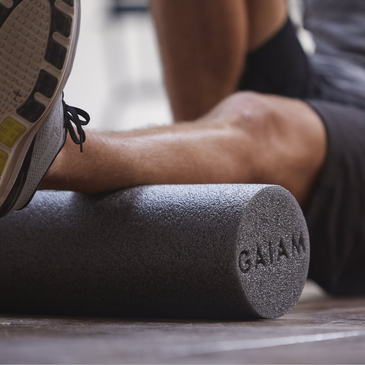 Restore Muscle Therapy Foam Roller grey used on calf