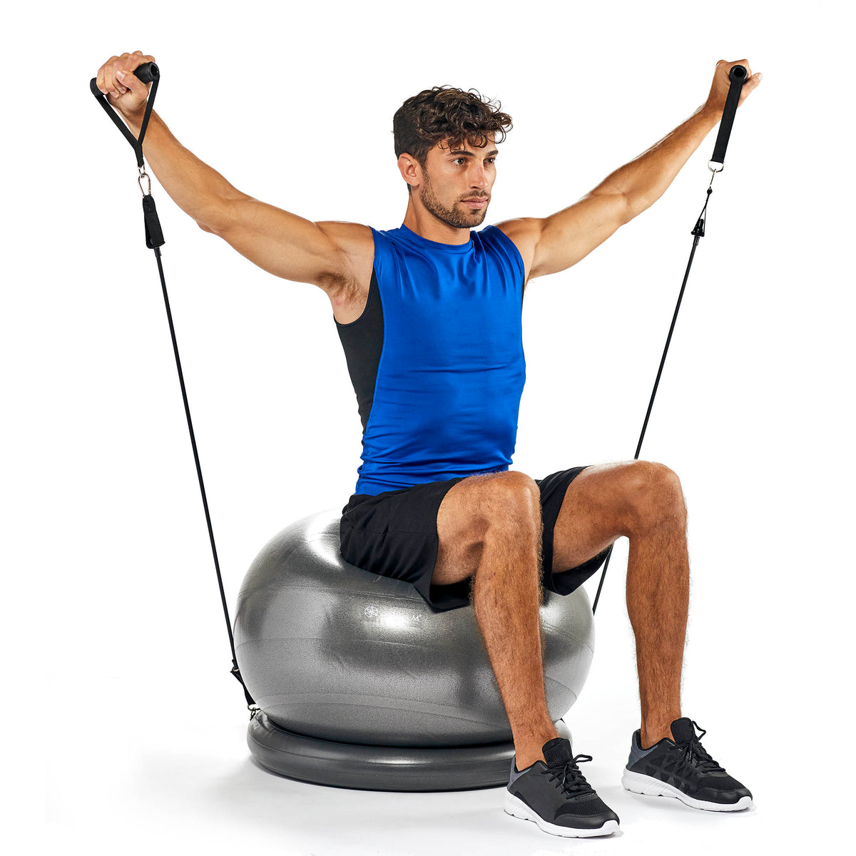 man using the fitness set sitting on the stability ball