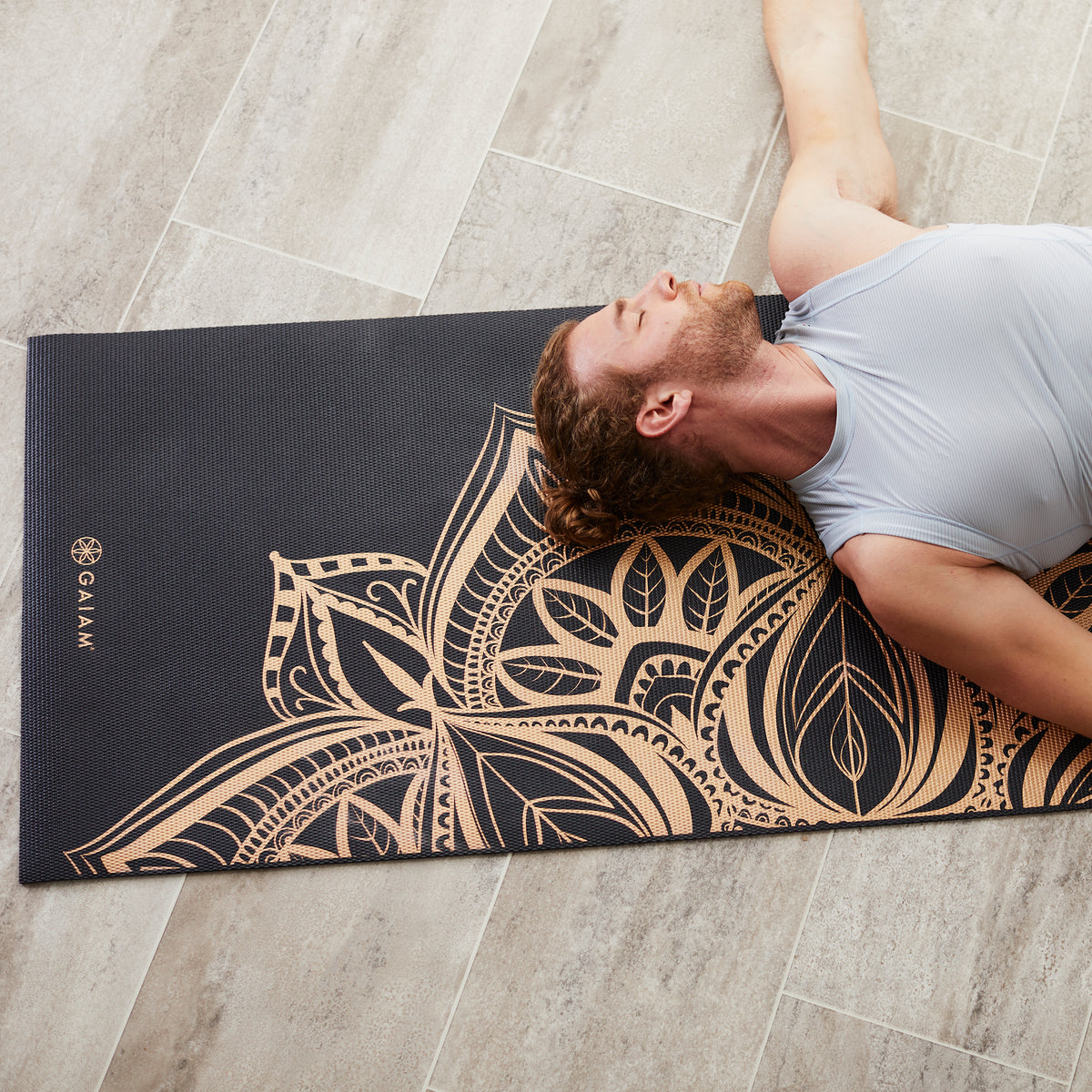 Person laying down on yoga mat