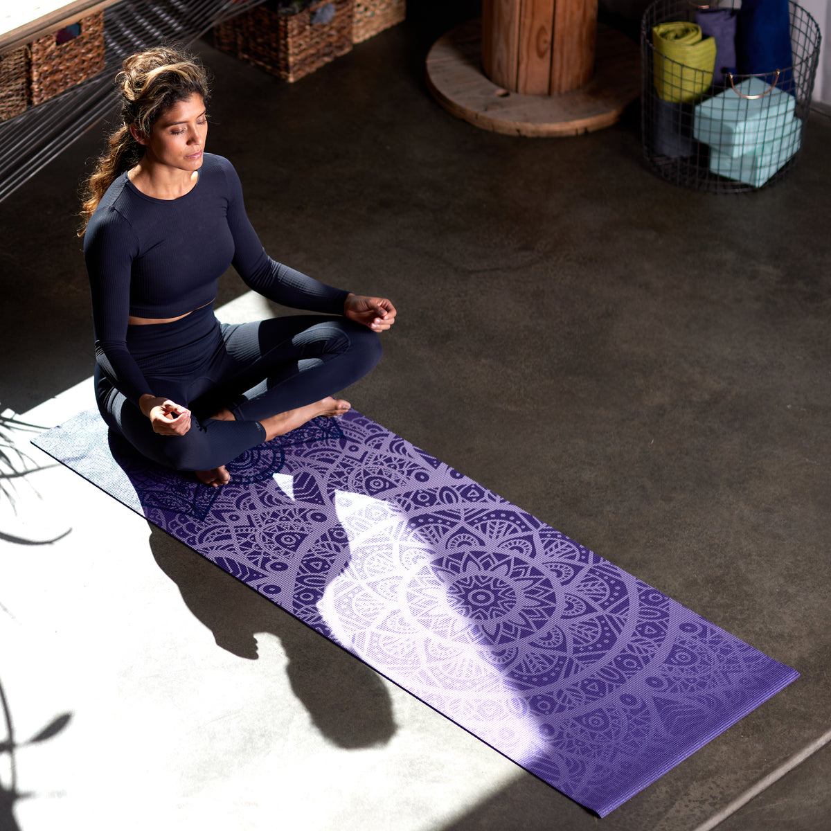 Woman meditating on Purple Lattice yoga mat