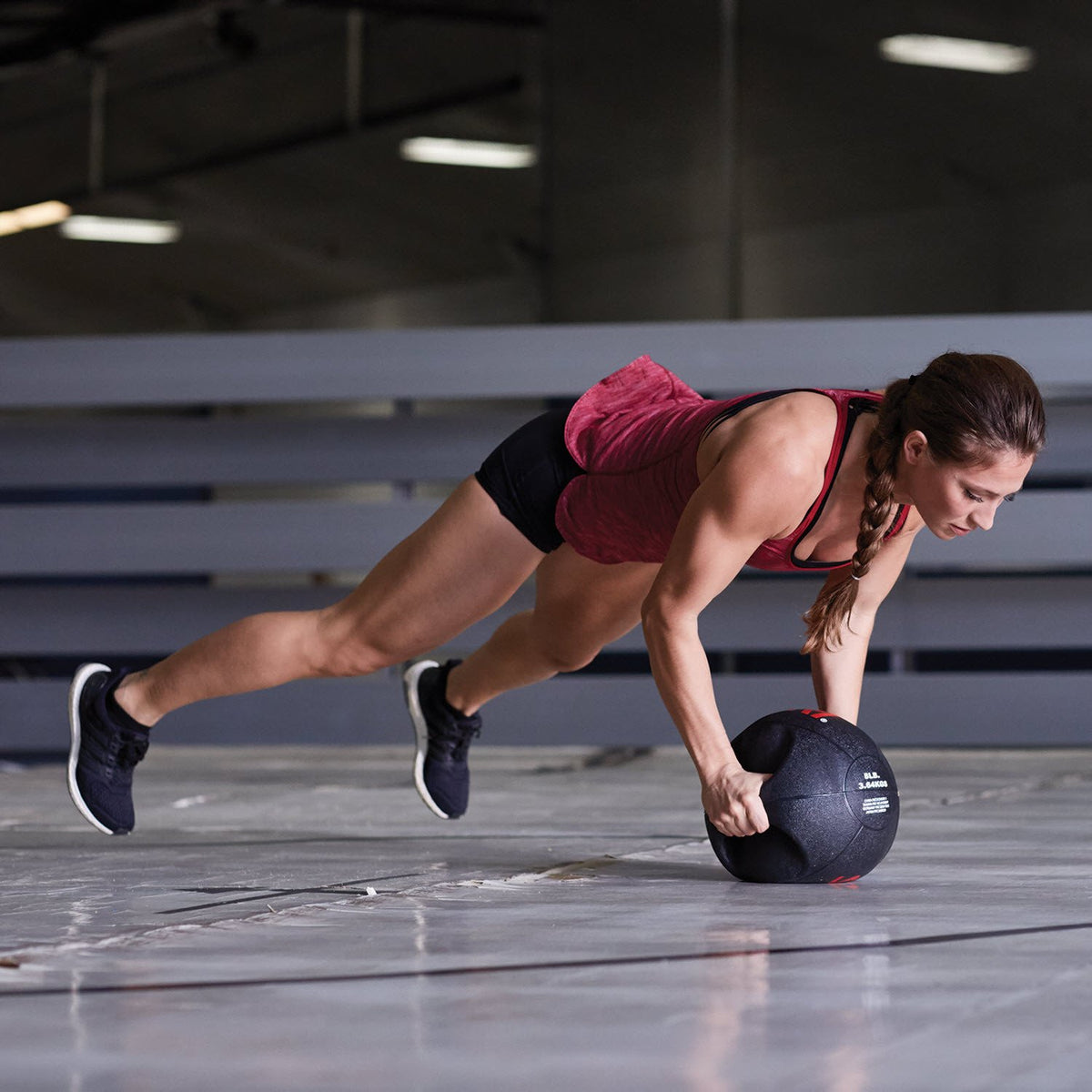 woman doing a pushup with the Dual Grip Xerball®
