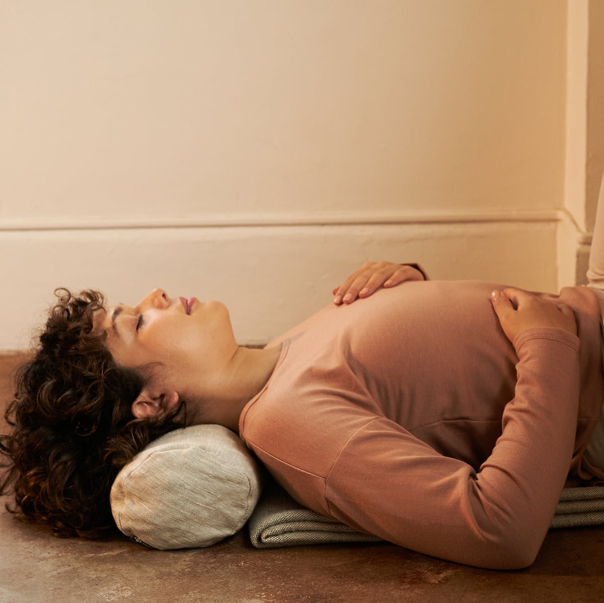Halfmoon Melange Cotton Yoga Blanket woman laying on blanket