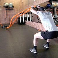 two men using battle ropes with the Stroops Portable Base