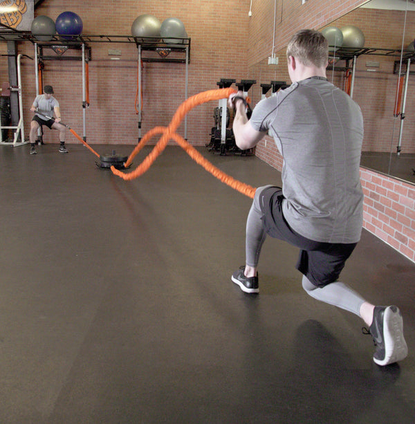 man using battle ropes with Stroops Portable Base