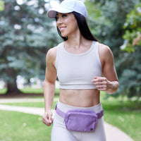 Woman wearing SideKick Waist Pack running