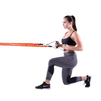Woman using the Resistance Slastix with handles for upper body work